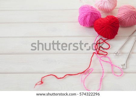 hearts made of red and pink wool yarn