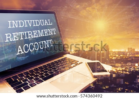 INDIVIDUAL RETIREMENT ACCOUNT : Grey screen laptop computer. Vintage effects. Digital Business and Technology Concept.