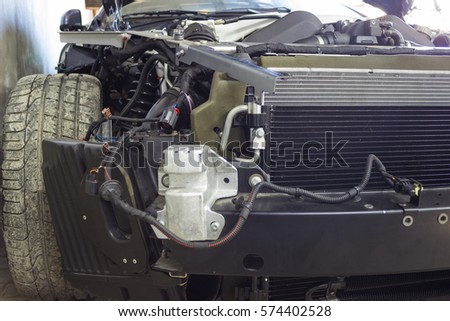 Car Photography bumper, fenders and hood. The car can be seen all power components and assemblies. Exposing the engine and radiators