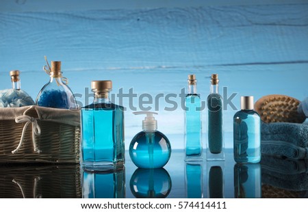 Bath cosmetics and accessories. Beautiful spa composition . Blue wooden background. Place for typography. 
