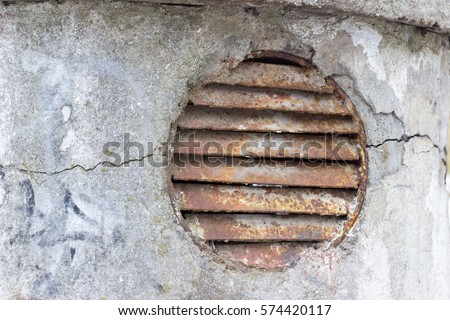 old rusty sewer ventilation grille