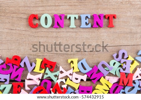 Text "Content" of colored wooden letters on a wooden background