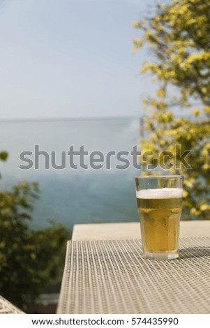 Beer on a table waits when it is drunk