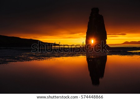 Hvitserkur 15 m height. Is a spectacular rock in the sea on the Northern coast of Iceland. On this photo Hvitserkur reflects in the sea water after the midnight sunset