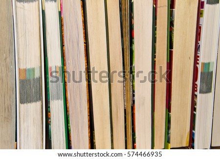 Many new books on a shelf. Books background