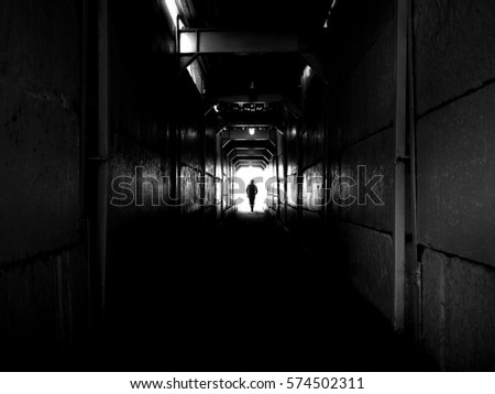 Man goes through a tunnel