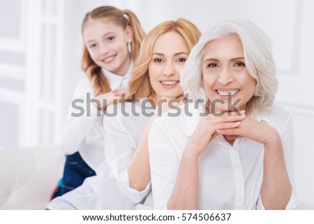 Cheeful femily resting on the couch Royalty-Free Stock Photo #574506637