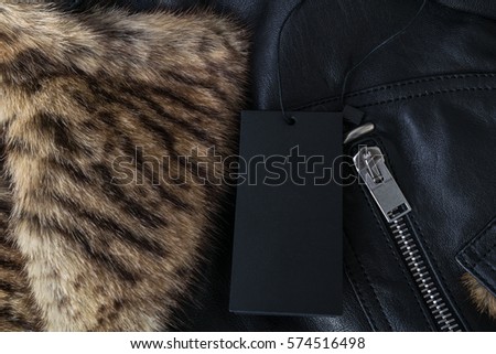Black Tag on a Leather Biker Jacket with Tiger Print Fur