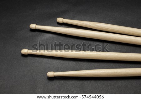 Drumsticks on a black background. Beautiful drumsticks