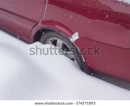Car wheel in snow.