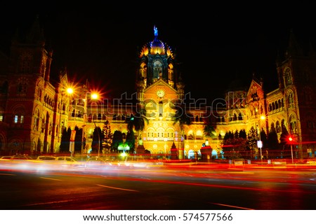 Chhatrapati Shivaji Maharaj Terminus (CSMT), formerly Victoria Terminus, is a historic railway station and a UNESCO World Heritage Site in Mumbai, Maharashtra, India. Night time. Light trail photo.
