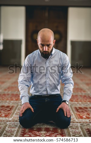 Muslim praying humbly in a mosque