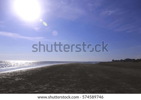 Sun , sea , blue sky and widely beach