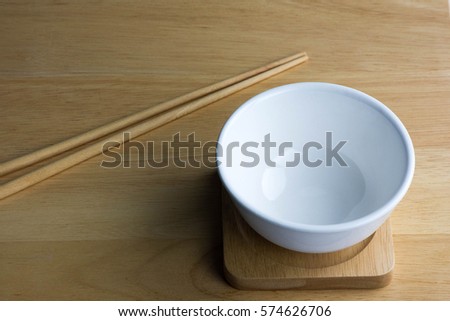 ceramic white bowl isolated on the wood table