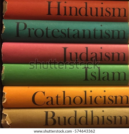 Stack of colorful books of different religions: Islam, Catholicism, Buddhism, Judaism, Protestantism, Hinduism Royalty-Free Stock Photo #574643362
