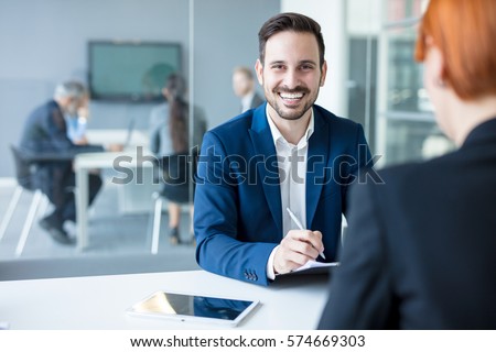 Team of successful business people having a meeting in executive Royalty-Free Stock Photo #574669303
