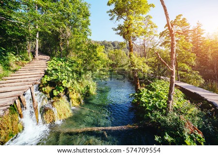 Majestic view on turquoise water and sunny beams. Picturesque and gorgeous scene. Popular tourist attraction. Location famous resort Plitvice Lakes National Park, Croatia, Europe. Beauty world. 