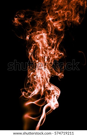 Abstract color smoke on black background, orange smoke backgroun