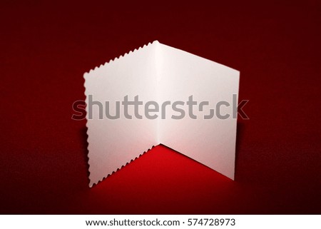 White card on a red background