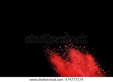 abstract red powder splatted on black background,Freeze motion of red powder exploding/throwing red powder