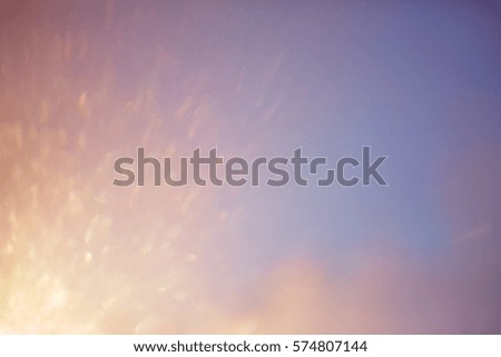 blurred beautiful natural landscape background with ray flare lights.blurry sunshine wallpaper concept.backdrop pastel tone.idyllic shores sundown hours.abstract dream magic coastline dramatic image.