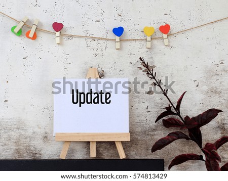 Update - business concept words on canvas with rustic wooden background