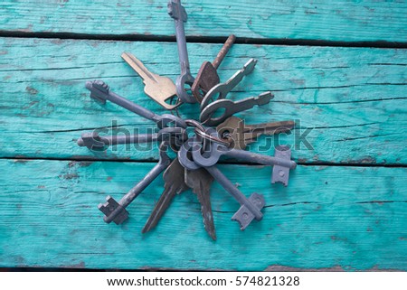Old keys on a green background
