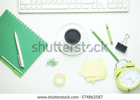  Office table with notebook, computer keyboard,stationary and coffee