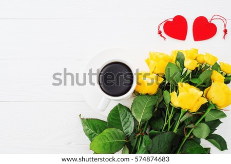 Cup of coffee with bouquet of yellow roses, flat lay, top view. Greeting card template. Floral background for mother's day, wedding invitation, greetings and invitation card. Valentines Day background