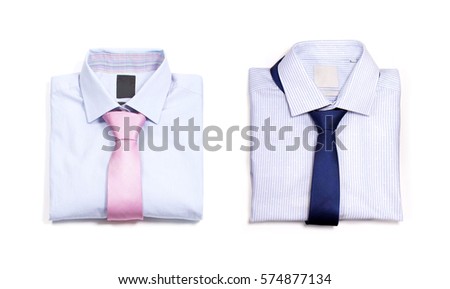 Two classic shirt. Folded shirts and ties on a white background