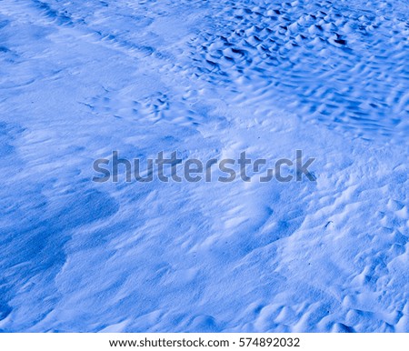 Dark blue light color. Natural texture and background of the desert. Sand patterns