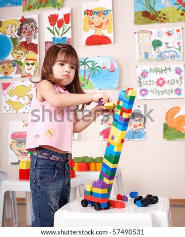 Child playing construction set.