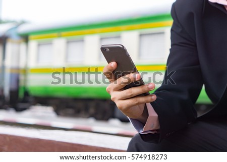 man's hands holding smart phone with blank copy space screen for text message or promotional content,male chatting in network on cell telephone while selective focus,vintage color