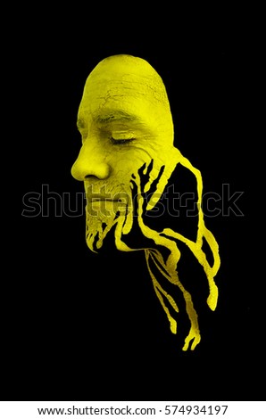 Creative makeup. Conceptual idea of bold body art painting. Abstract picture on male face.