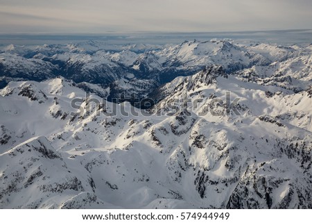 Aerial view of the snow covered mountain in British Columbia, Canada. Picture taken from an airplane north of Vancouver, BC.