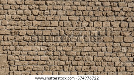 Old Castle wall made of small limestone bricks