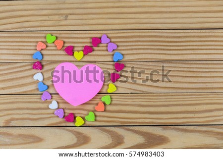 Abstract empty sticky note with heart magnet on Blackboard. valentine greeting card message.