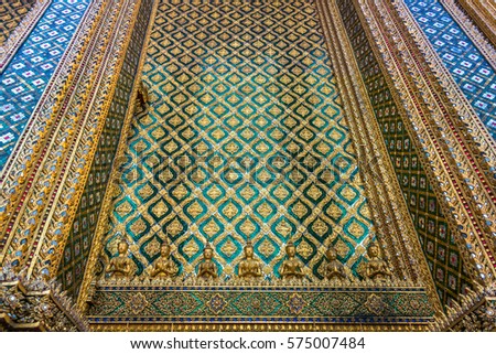 Beautifully decorated mosaic wall of building in Grand Palace architectural complex. Bangkok, Thailand