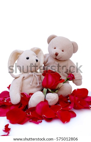 Little bunny doll With red roses on a white background for part of love.Valentin day