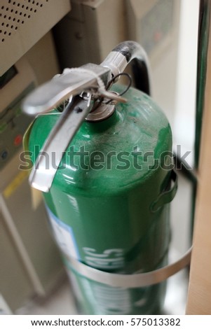 Selective focus green fire extinguisher