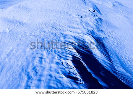 Dark blue light color. Natural texture and background of the desert. Sand patterns