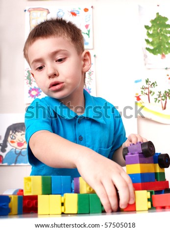 Little boy playing lego block and construction set.