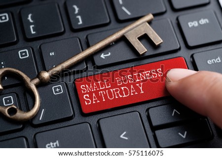 Closed up finger on keyboard with word SMALL BUSINESS SATURDAY Royalty-Free Stock Photo #575116075