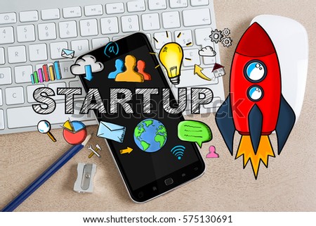 Startup presentation with rocket and icons on desk office background