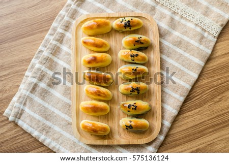 Chinese Pastry row on wooden tray