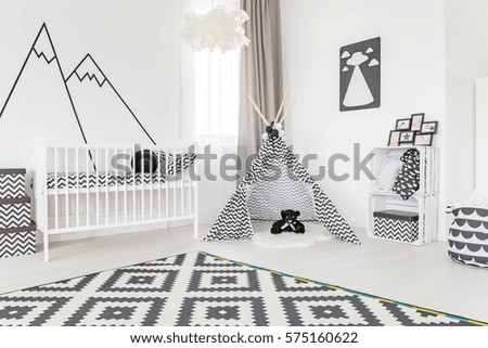 Spacious baby room with a tipi in the middle