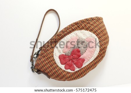 Quilt wallet bag, hat girl doll pattern. Japanese handcraft. Signed property release. Isolated on white background.