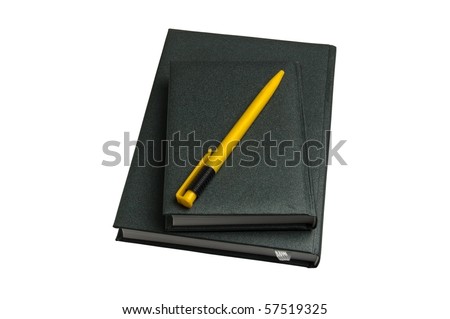Two green notebooks and yellow pen isolated over white background