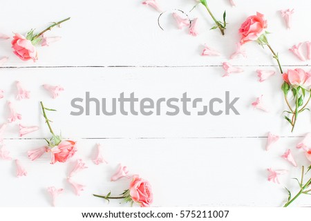 Flowers composition. Pink flowers on white wooden background. Valentine's Day. Flat lay, top view, copy space