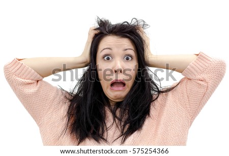 Headshot of hysterical Caucasian freckled student girl looking in despair and panic, being late for important exam or event, not knowing what to do, hands on her head, mouth wide open Royalty-Free Stock Photo #575254366